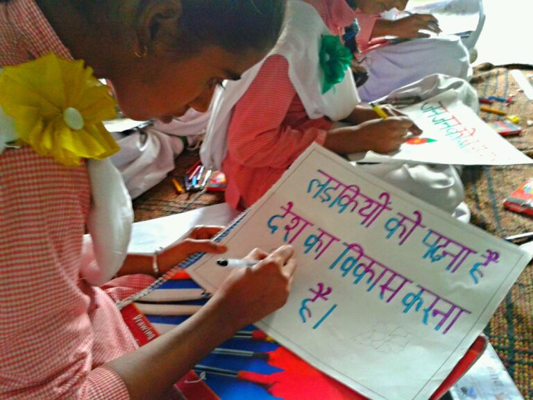 2- Girls making a poster